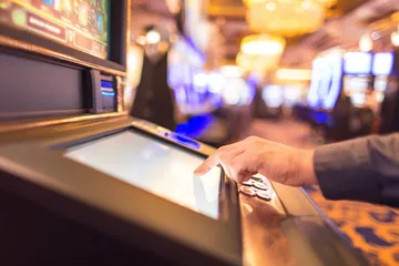 CHEZA GAME Mobile App — Your complete hub for casino and sports A man focused on his laptop with live stats in the background, highlighting the dedicated sports and gaming features of the CHEZA GAME mobile app.