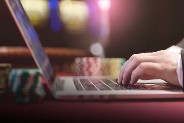 CHEZA GAME Live Casino — Join thrilling real-dealer tables A professional dealer in a tuxedo greeting players at the roulette table, symbolizing the authentic live casino feel at CHEZA GAME.