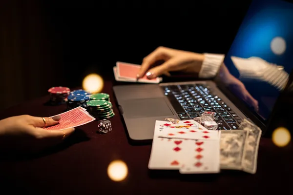 A player using their smartphone during a festive local event, representing CHEZA GAME’s fully mobile-friendly casino.